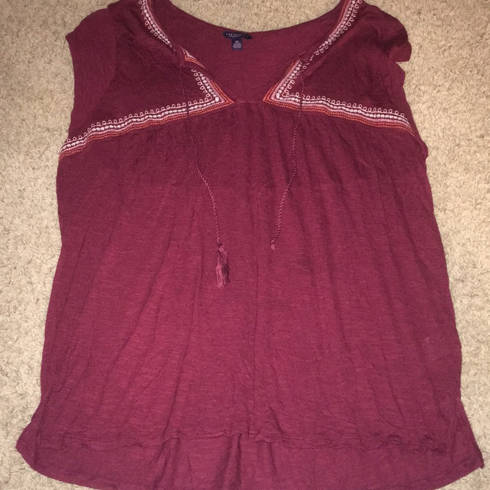 A maroon tee shirt